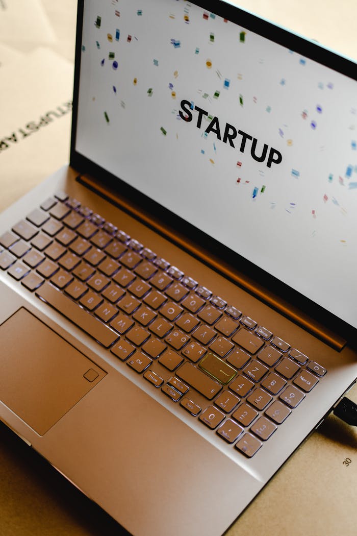 Close-up of a laptop screen displaying the word "STARTUP", ideal for business and tech themes.